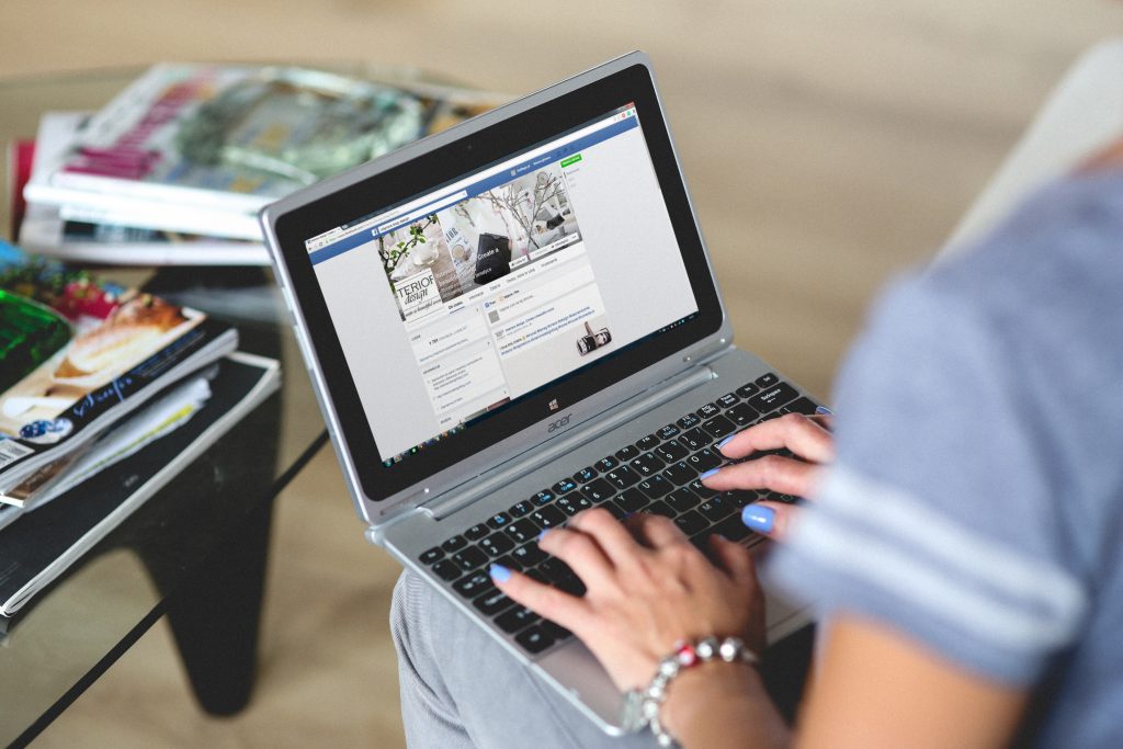 A seller using social media in Kenya with Facebook to create an online shop.